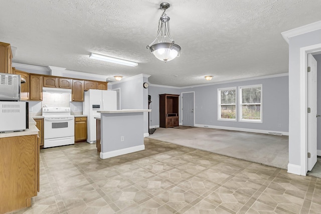 kitchen with a textured ceiling, pendant lighting, white appliances, and ornamental molding