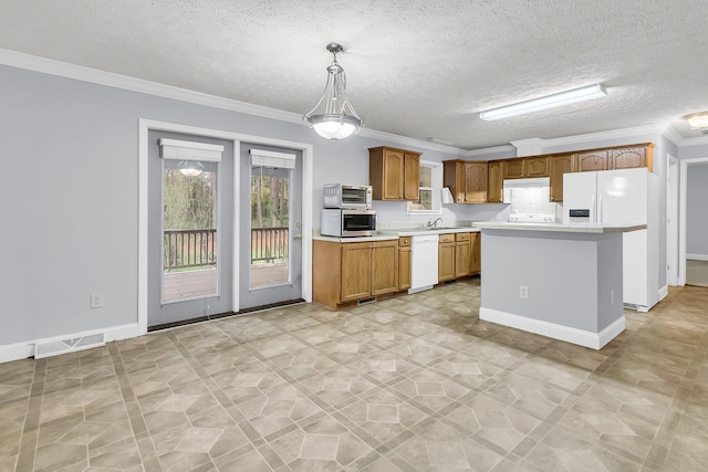 kitchen featuring ornamental molding, a textured ceiling, white appliances, a center island, and hanging light fixtures