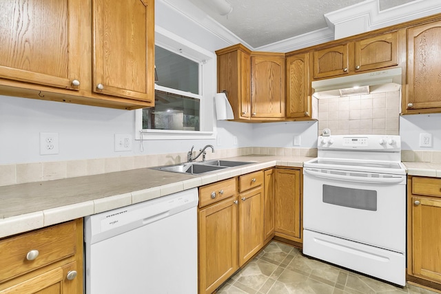 kitchen with backsplash, a textured ceiling, white appliances, crown molding, and sink