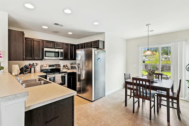 161 Brittondale Rd, Summerville, SC 29485 - kitchen featuring dark brown cabinetry, visible vents, appliances with stainless steel finishes, light countertops, and a sink