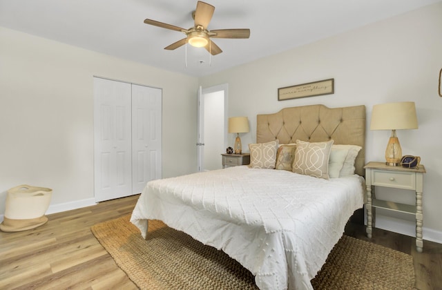 1515 Mulberry St, Charleston, SC 29407 - bedroom featuring baseboards, wood finished floors, a closet, and a ceiling fan