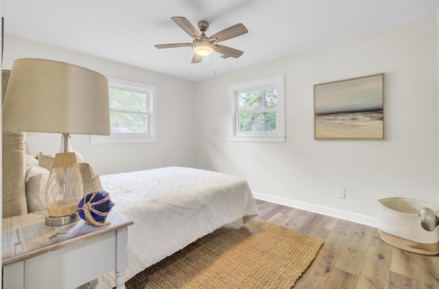 1515 Mulberry St, Charleston, SC 29407 - bedroom featuring multiple windows, wood finished floors, baseboards, and a ceiling fan