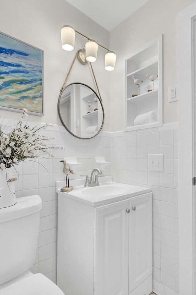 1515 Mulberry St, Charleston, SC 29407 - half bath featuring tile walls, toilet, vanity, and a wainscoted wall