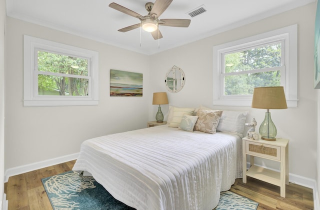 1515 Mulberry St, Charleston, SC 29407 - bedroom with multiple windows, wood finished floors, and baseboards
