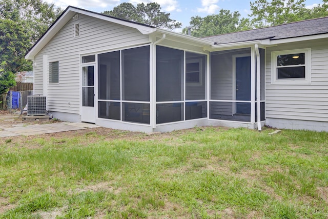 1515 Mulberry St, Charleston, SC 29407 - back of property with a sunroom, central air condition unit, a lawn, and roof with shingles
