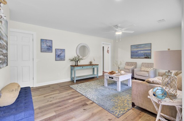 1515 Mulberry St, Charleston, SC 29407 - living area with wood finished floors, ceiling fan, and baseboards