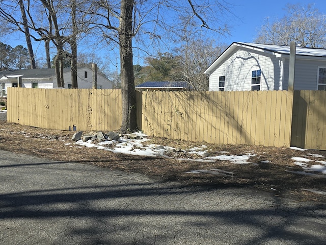 yard covered in snow with fence