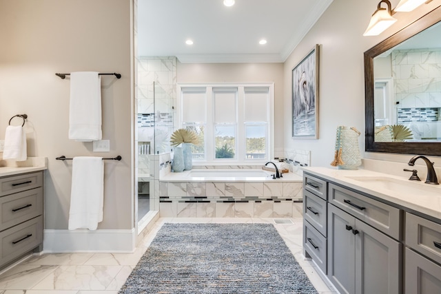 full bathroom featuring marble finish floor, a stall shower, ornamental molding, a bath, and vanity