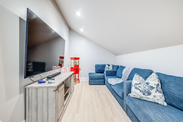 living room with recessed lighting, light wood-style flooring, baseboards, and lofted ceiling