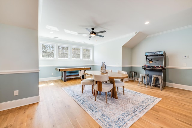 dining space with baseboards, wood finished floors, a ceiling fan, and ornamental molding