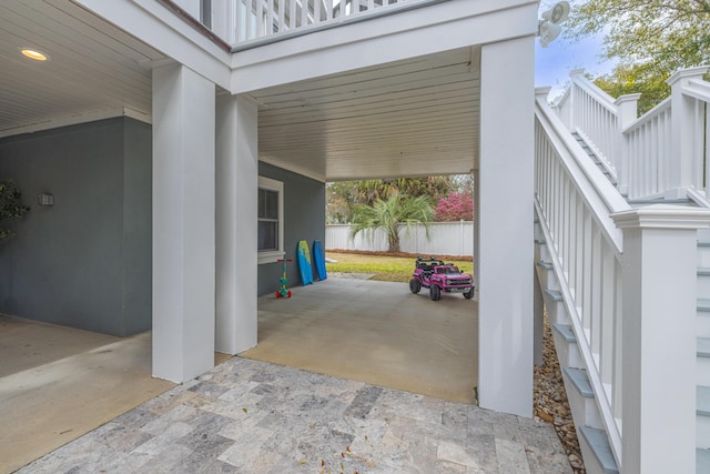 view of patio / terrace with stairs and fence