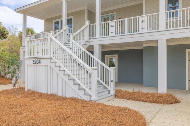 view of exterior entry with covered porch