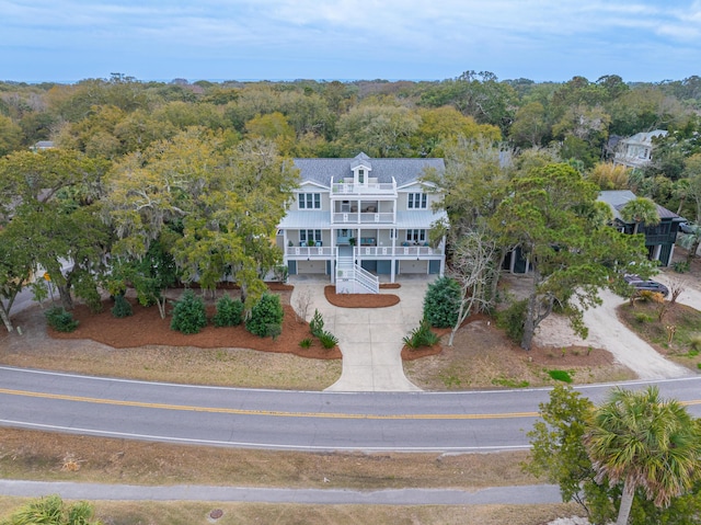 birds eye view of property with a wooded view