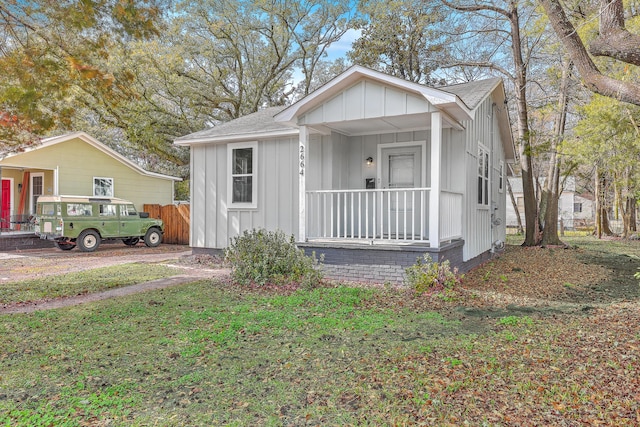 bungalow-style house with board and batten siding and a porch