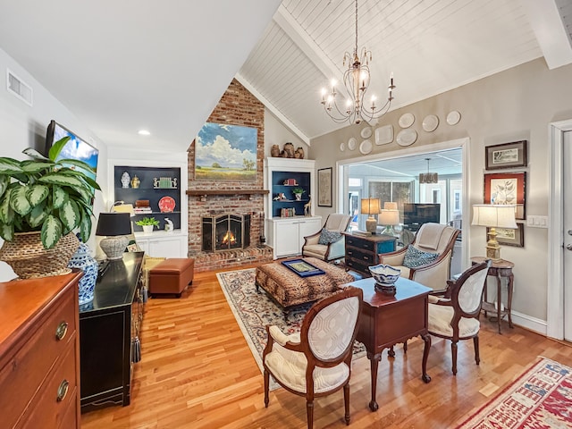 living room with light wood finished floors, a chandelier, vaulted ceiling with beams, visible vents, and wood ceiling