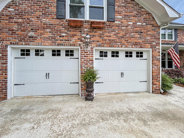garage featuring driveway