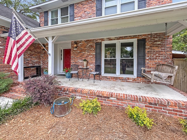 view of patio featuring a porch