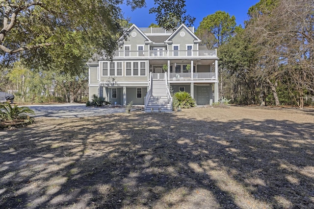 view of front of property with covered porch and a garage