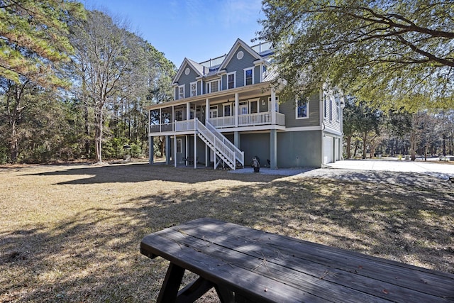 view of front of property featuring a porch and a garage