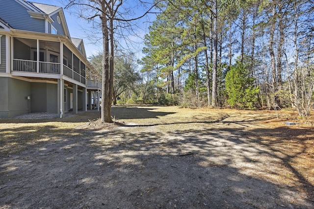 view of yard with a sunroom