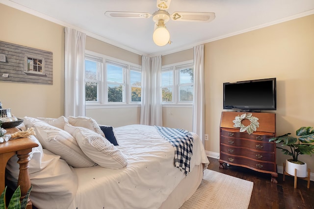 bedroom with ceiling fan, dark hardwood / wood-style flooring, and crown molding