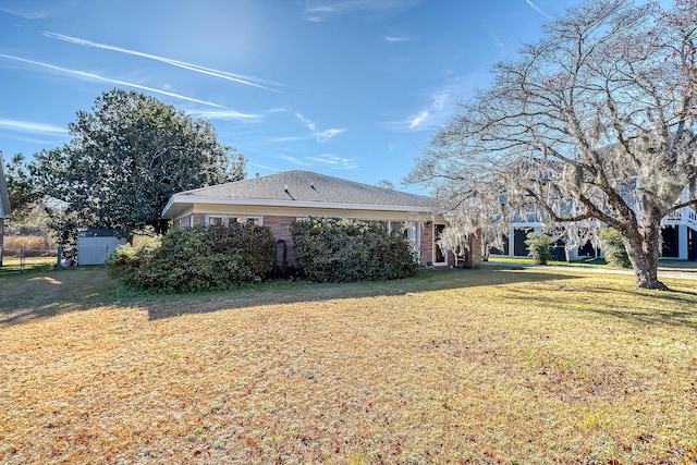 view of property exterior featuring a lawn