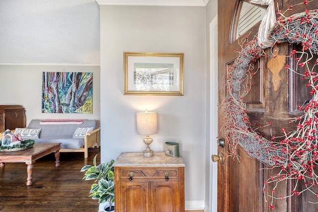 interior space with hardwood / wood-style flooring and crown molding