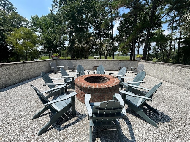 view of patio / terrace featuring an outdoor fire pit