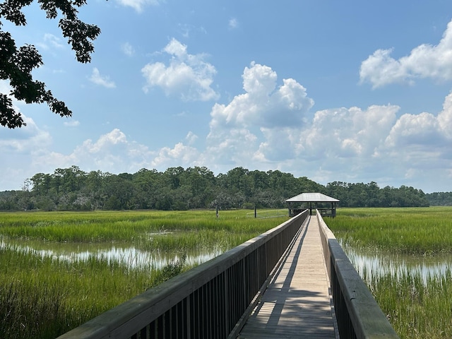 view of dock featuring a gazebo and a water view