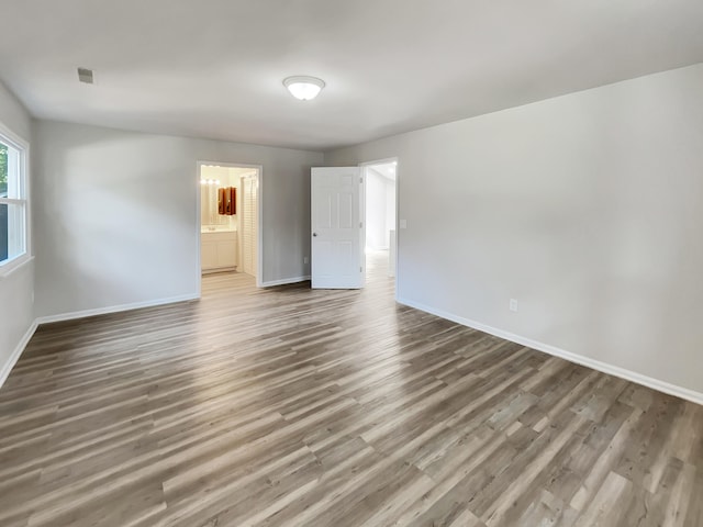 spare room with hardwood / wood-style flooring