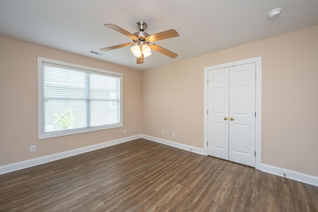 2301 N Creek Dr, Mount Pleasant, SC 29466 - unfurnished bedroom with dark wood-type flooring, baseboards, a closet, and ceiling fan