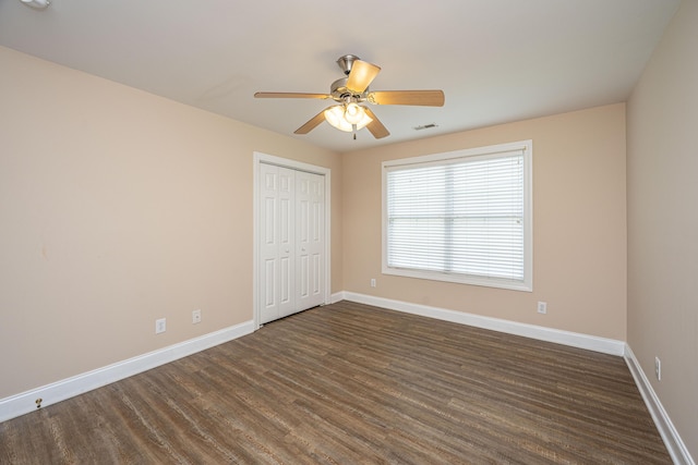 2301 N Creek Dr, Mount Pleasant, SC 29466 - unfurnished bedroom with dark wood-style floors, baseboards, a closet, and ceiling fan