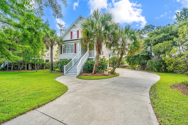 2301 N Creek Dr, Mount Pleasant, SC 29466 - beach home featuring stairs, driveway, a front lawn, and covered porch