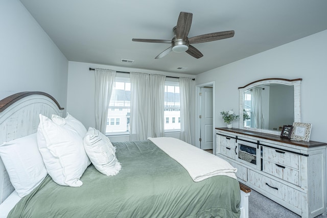 bedroom featuring visible vents and ceiling fan