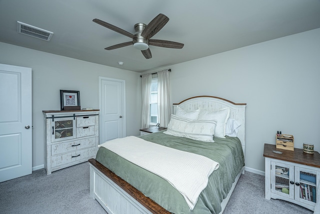 carpeted bedroom with baseboards, visible vents, and ceiling fan