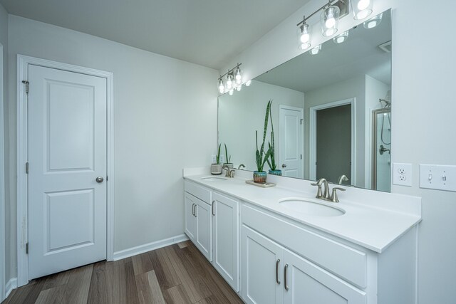 bathroom featuring hardwood / wood-style flooring and vanity