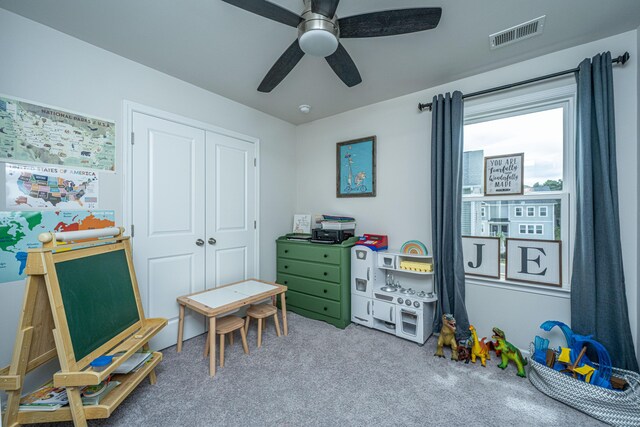 rec room featuring ceiling fan and carpet floors