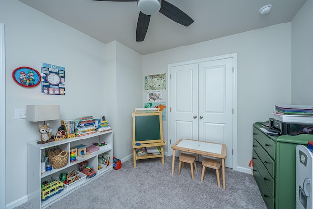 playroom with carpet, baseboards, and ceiling fan