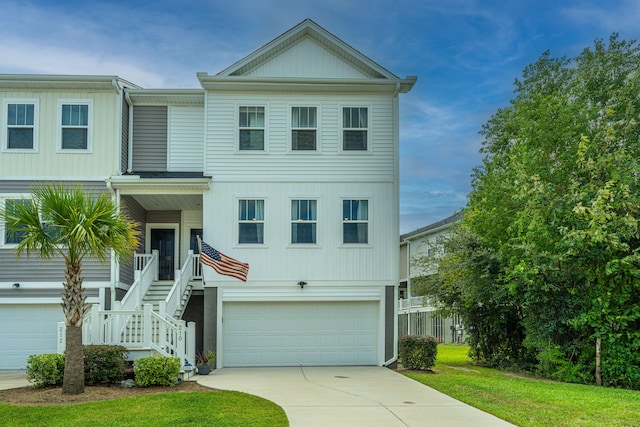 view of front of house featuring a garage and a front lawn