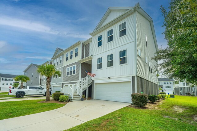 view of front of house with a garage and a front lawn