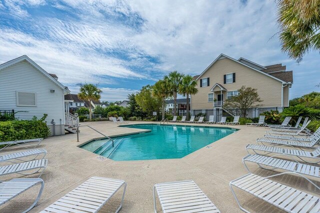 view of swimming pool featuring a patio