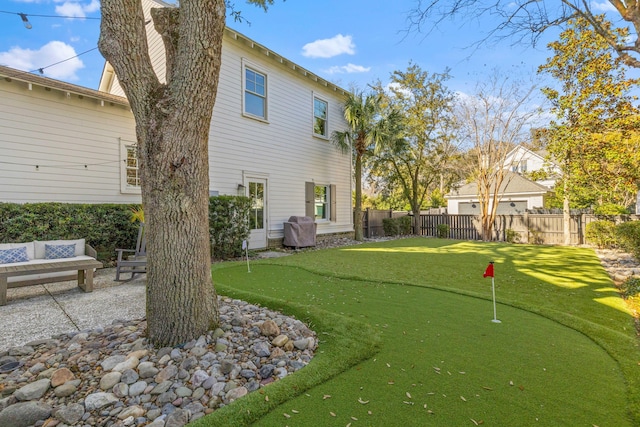 back of property featuring a fenced backyard and a patio