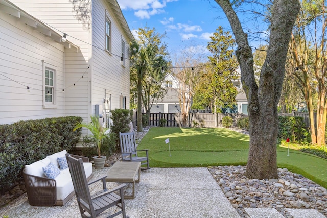 view of patio / terrace featuring a fenced backyard and an outdoor living space