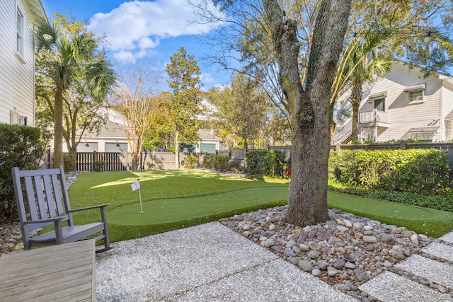 view of home's community featuring a residential view, a fenced backyard, and a patio