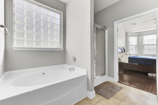 ensuite bathroom featuring visible vents, connected bathroom, baseboards, a stall shower, and a bath