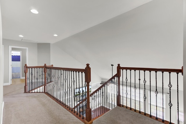 corridor with carpet, vaulted ceiling, recessed lighting, and an upstairs landing