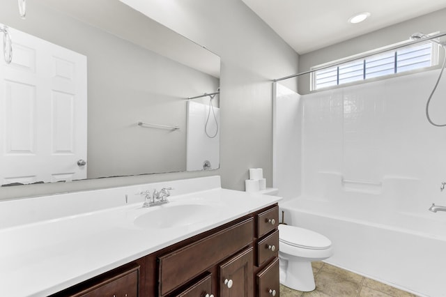 bathroom with vanity, toilet, and washtub / shower combination