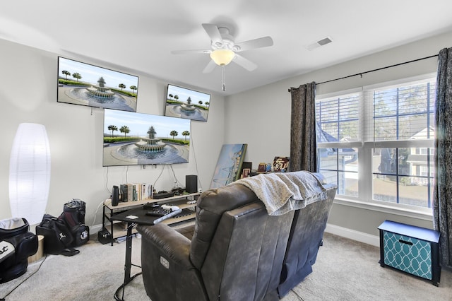 living room with a ceiling fan, carpet flooring, baseboards, and visible vents