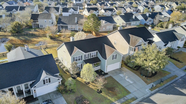 birds eye view of property with a residential view