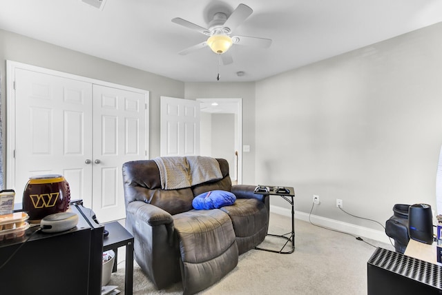 living room with light colored carpet, baseboards, and ceiling fan